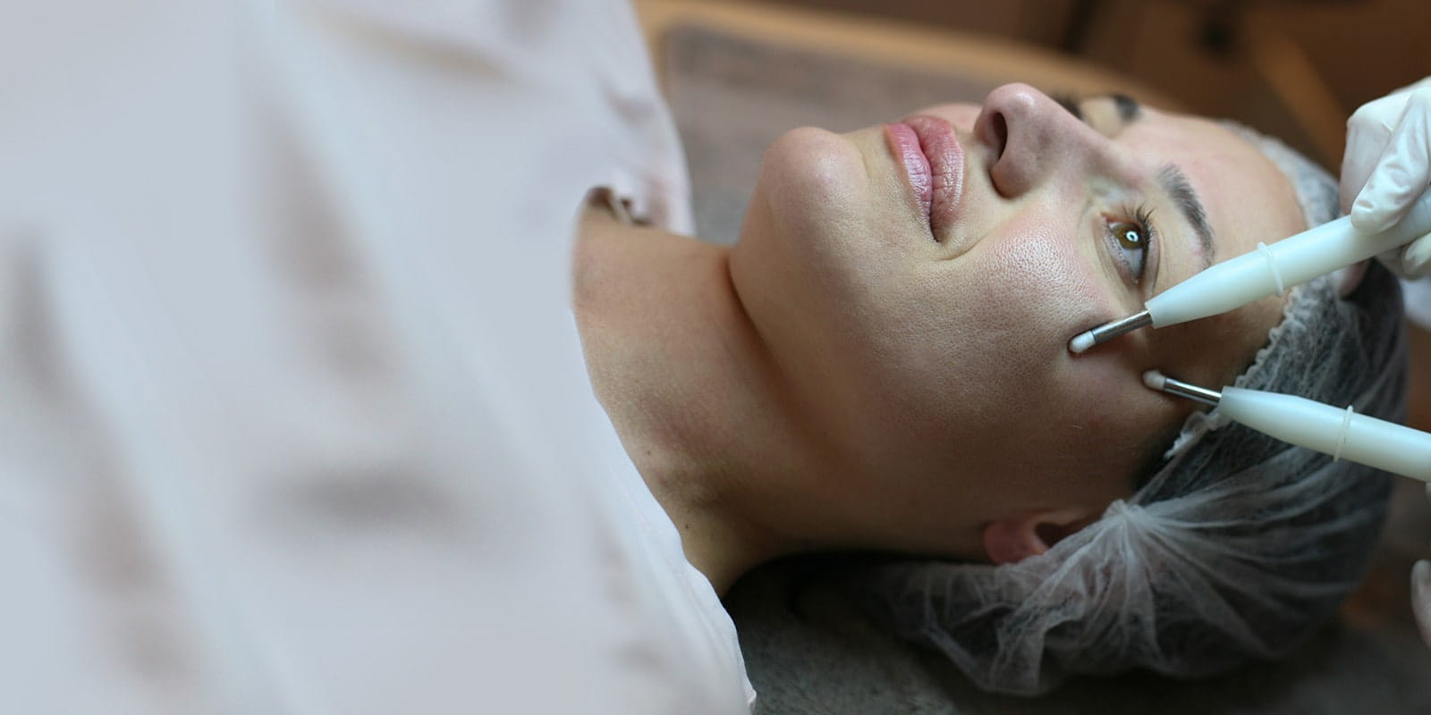 Young woman having surgery on face.