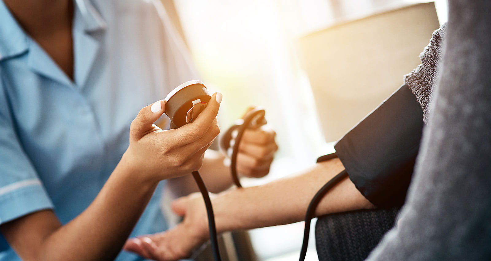 Cropped shot of a senior woman getting her blood pressure measured during a checkup with a nurse
