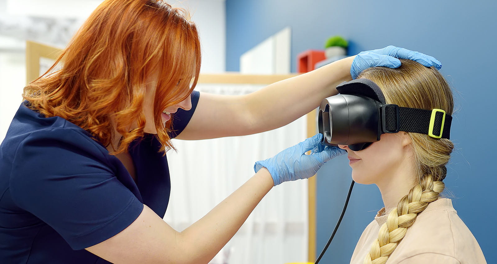 Neurologist performing positional testing of patient using videonystagmography
