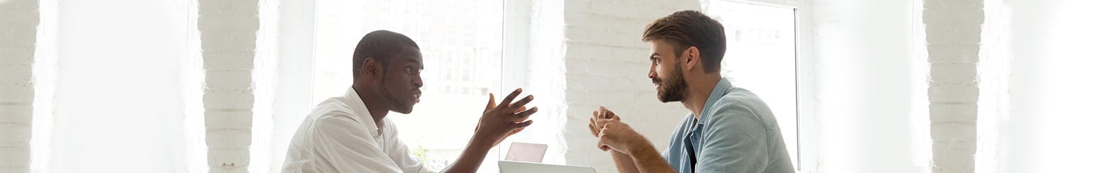 Two men having an engaging conversation.