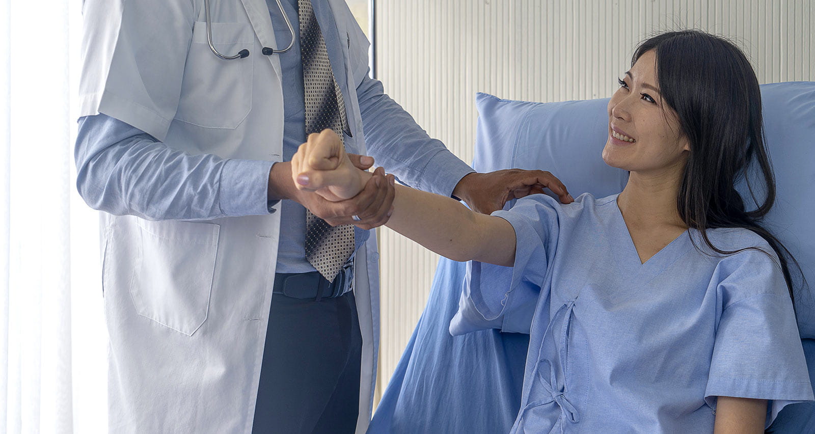 A doctor is investigating a female patient with arm pain