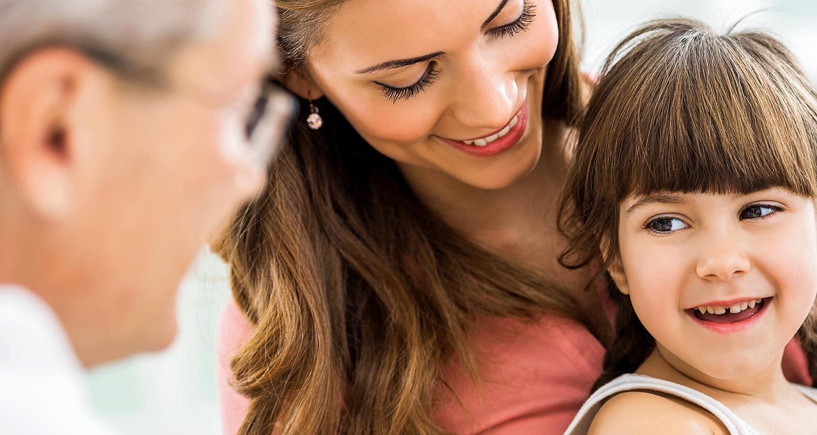 Mother and daughter receiving a vaccination