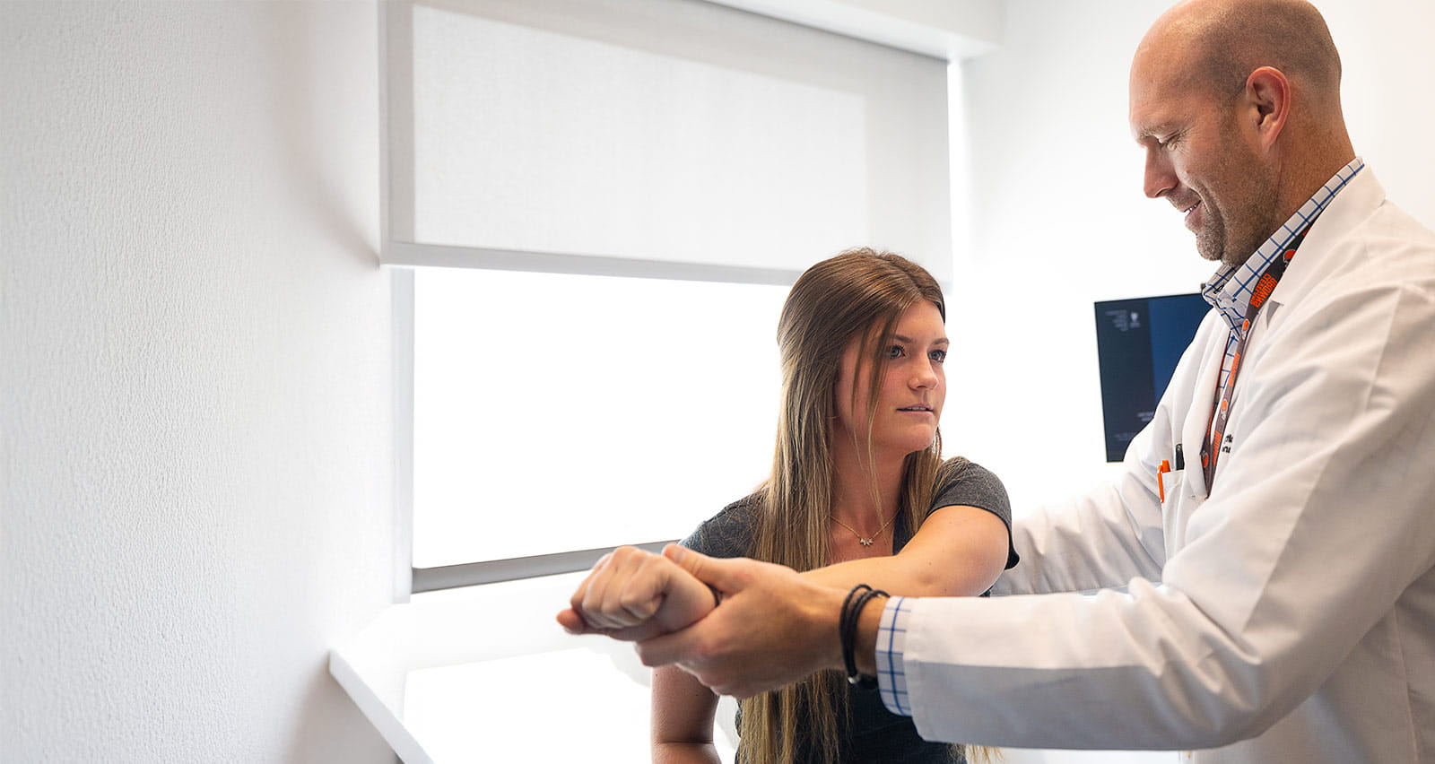 Benjamin Boswell, DO treats a young female patient