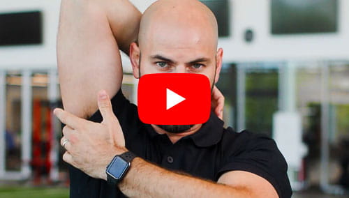 UH physical therapist Bradley Brigagliano demonstrating a cool down technique for baseball and softball players