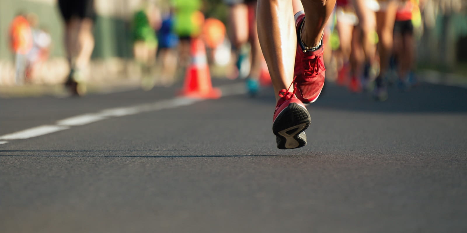 The feet of a runner on the ground