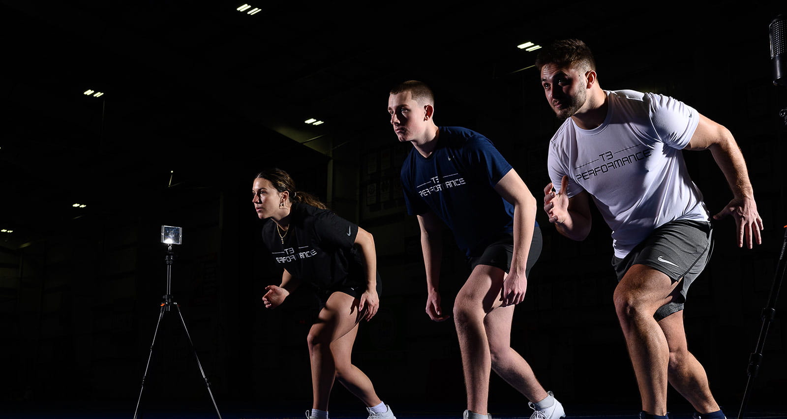 Three runners at the start line