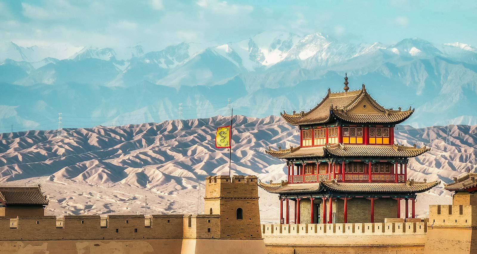 Jiayuguan Pass in the background of snow mountains