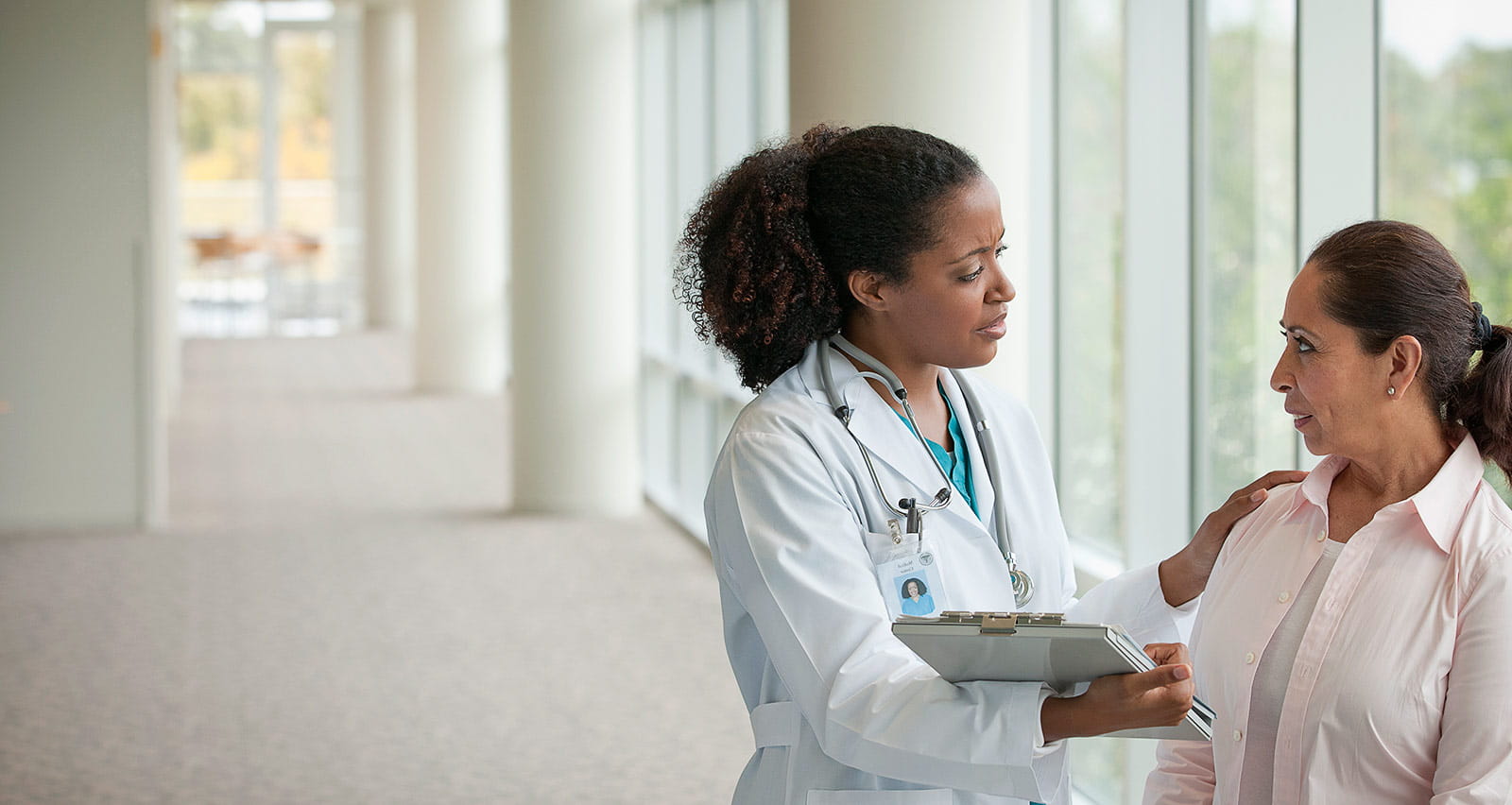 A female doctor talks to a female urology patient