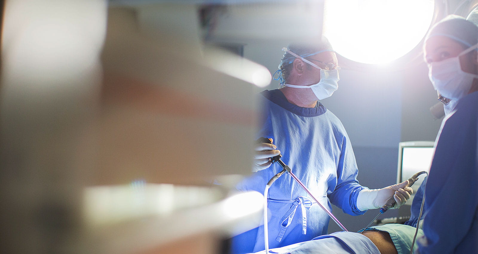 Doctors performing surgery in an operating theater