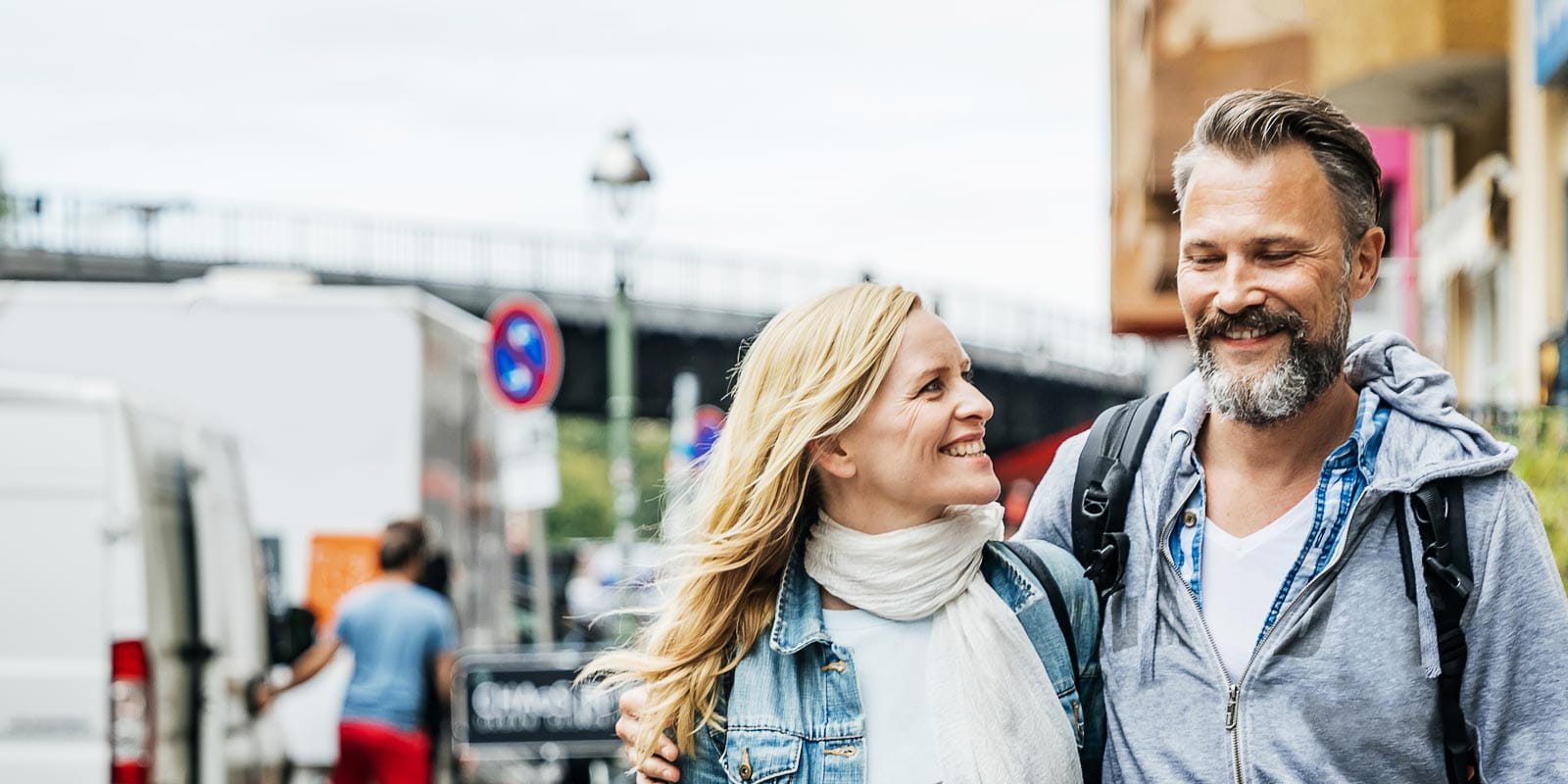Middle-aged Couple Embrace While Out Exploring The City