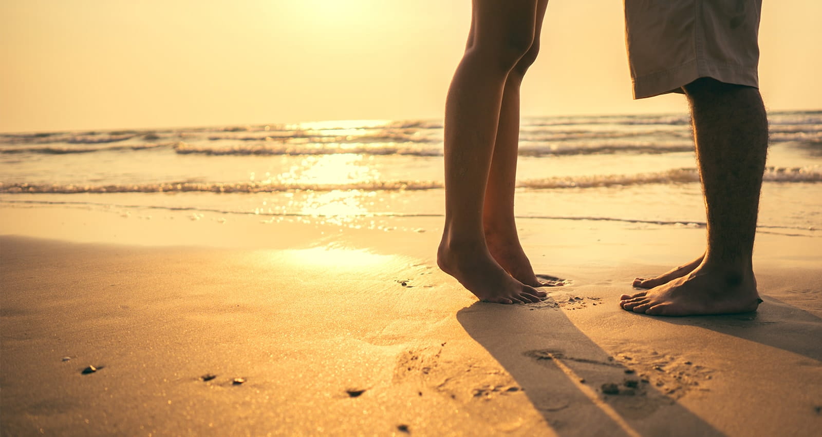 Couple at beach at sunset