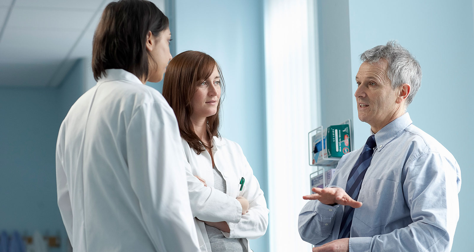 Three doctors having a discussion