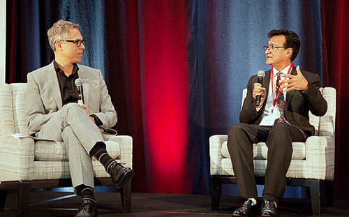 Dr. Patrick Runnels MD, MBA, (left) and Dr. Charles Macias, MD, MPH, (right) speaking at Intersection Conference: Innovation Panel