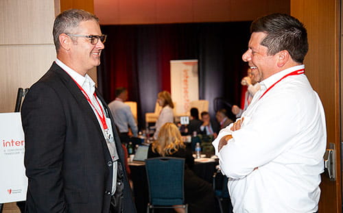 Two men discuss Intersection