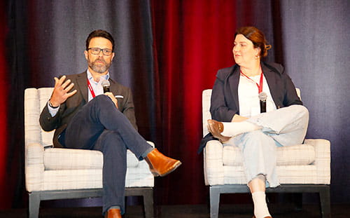 Brandon Cornuke (left) and Sarah Edwards (right) sharing the mission of Veale Healthcare Transformation Institute and the Intersection Conference