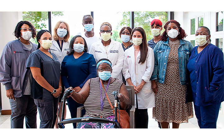 Mary Hollingsworth surrounded by her care team at UH