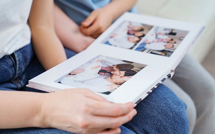 Family looks at photo album