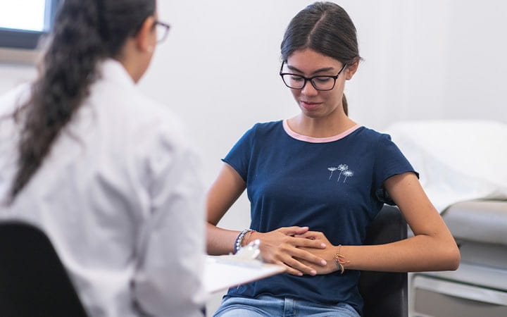 child with stomach pain visits doctor