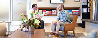 Physician talking with patient about a clinical trial